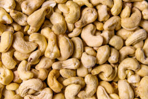 Cashews. Close up of cashew nuts background. Healthy food concept. Top view